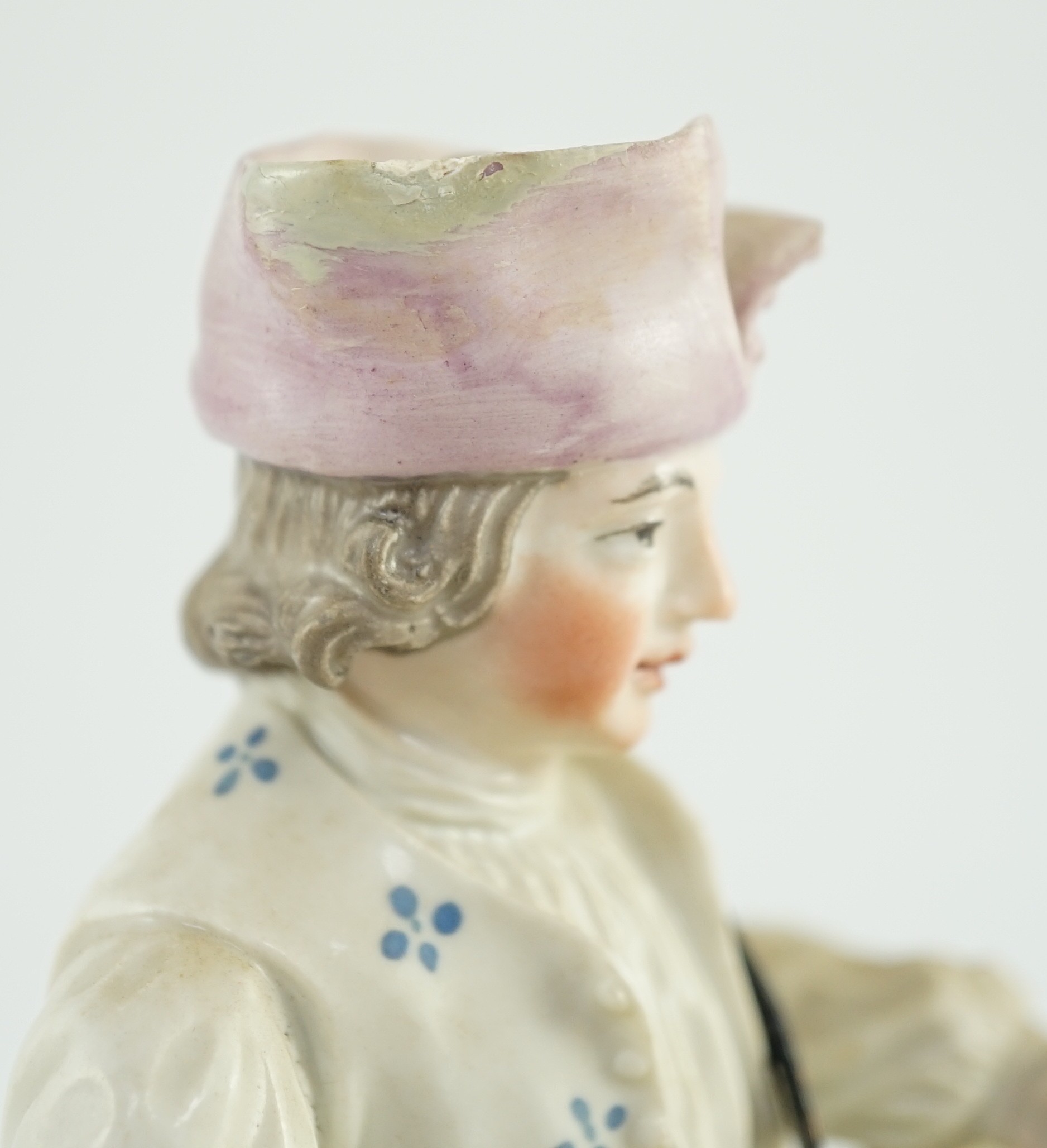 A Frankenthal porcelain figure of a zither player, c.1760, 15cm high, small areas of restoration, Provenance - purchased from Winifred Williams, Eastbourne/London before 1970.